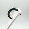 Single earring shown on white display, highlighting bezel set stones and polished silver finish