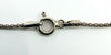 Close-up of sterling silver chain spring ring clasp showing 925 stamp and Italy mark on the end tab.