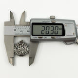 Digital caliper measuring the vintage sterling silver St Christopher pendant at approximately 20.30mm.