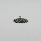 Low side view of vintage sterling silver St Christopher pendant charm with raised front detail.