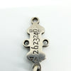 Close-up of a sterling silver St Johns Ambulance award bar showing maker, Birmingham and silver hallmarks.