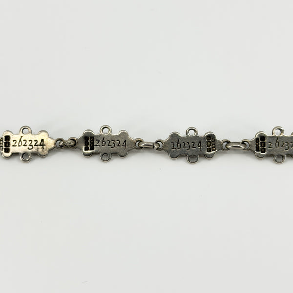 Reverse of the sterling silver St Johns Ambulance watch chain showing stamped number 262324 on linked award bars.