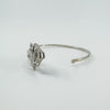 Side view showing hook clasp and curved shape of sterling silver bangle