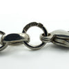 Close-up of the sterling silver chain ring with 925 stamp and hallmark details visible