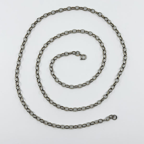Vintage sterling silver belcher chain necklace laid flat, showing the 26 inch length and spring clasp