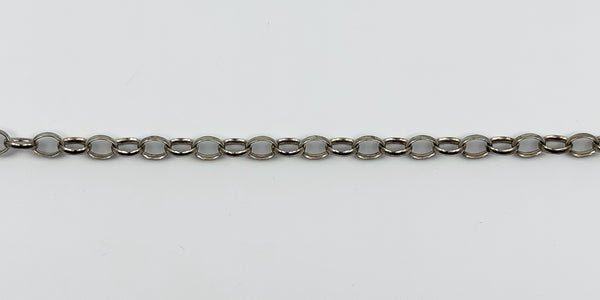Close up of vintage sterling silver belcher chain links showing the oval link style and polished finish