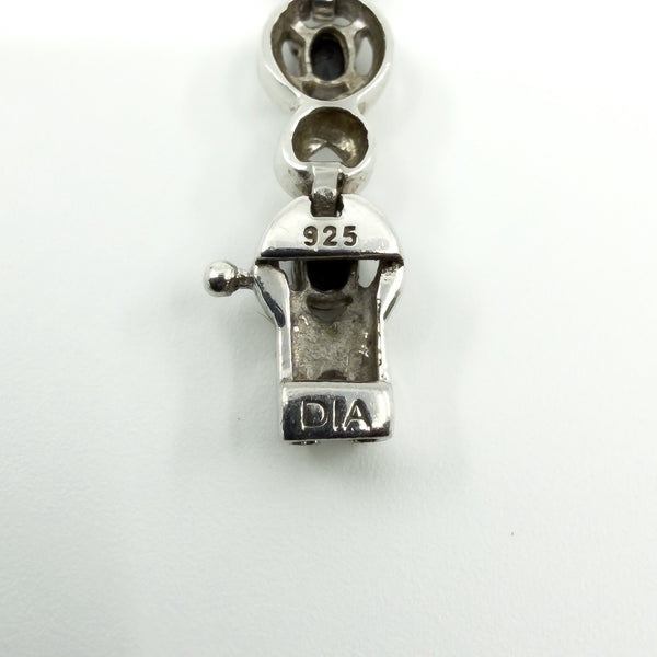 Close up of 925 and DIA stamp on sterling silver sapphire and diamond bracelet clasp