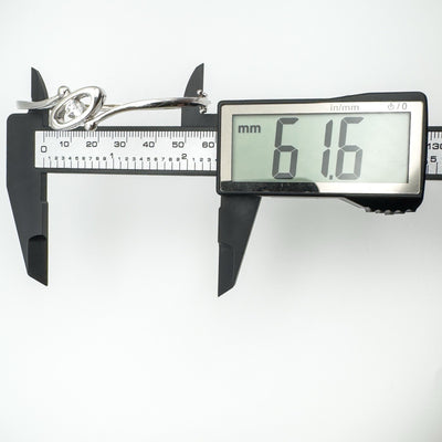 Internal width of sterling silver CZ bangle bracelet shown as 61.6mm on digital caliper