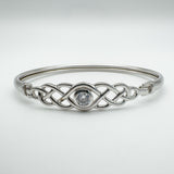 Front view of sterling silver Celtic knot bangle with central cubic zirconia stone