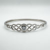 Front view of sterling silver Celtic knot bangle with central cubic zirconia stone