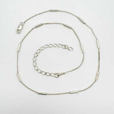 16” sterling silver chain with tubular links and lobster clasp, adjustable to 19”