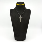 Vintage sterling silver engraved cross pendant shown on a black display bust.