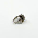 Side view of vintage sterling silver elephant locket ring showing raised trunk, ear and wide band