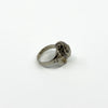 Side view of vintage sterling silver elephant locket ring showing raised trunk, ear and wide band