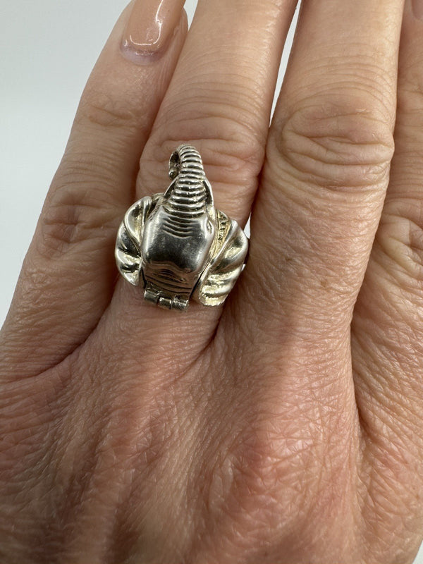 Vintage sterling silver elephant ring worn on hand, front view showing the elephant head design