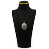 Sterling silver oval engraved photo locket shown on a black jewellery display bust