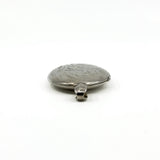 Low side view of the sterling silver engraved oval locket showing the rounded edge