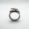 Side profile showing raised 3D floral design on sterling silver ring