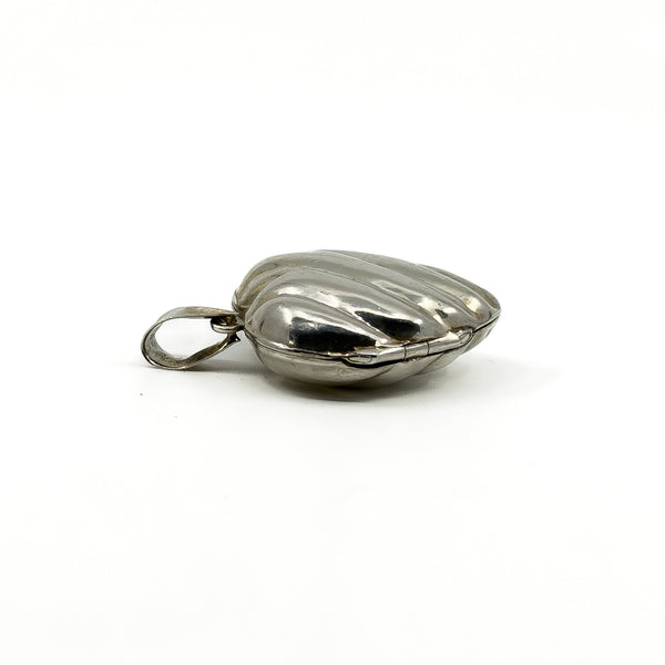 Side view of the vintage sterling silver puffy heart locket with large bail.