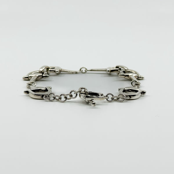 Low side view of vintage sterling silver horsebit snaffle bracelet showing the link profile.