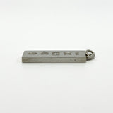 Side profile of vintage sterling silver rectangular ingot pendant showing chunky depth