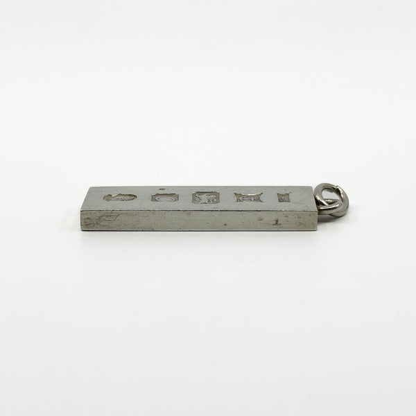 Side profile of vintage sterling silver rectangular ingot pendant showing chunky depth