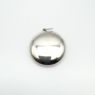 Back view of closed sterling silver mirrored locket pendant