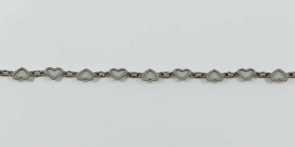 Close up of vintage sterling silver open heart necklace links with polished silver finish