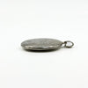 Side profile of a sterling silver oval photo locket showing its chunky depth and bail