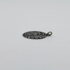 Side view of sterling silver St Christopher pendant charm showing the textured edge and jump ring.