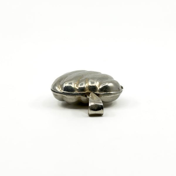Low side view of the sterling silver puffy heart photo locket showing the rounded puffy shape.
