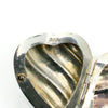 Close up of the 925 stamp inside the sterling silver puffy heart photo locket.