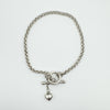 Sterling silver rolo chain bracelet with heart charm and T-bar clasp