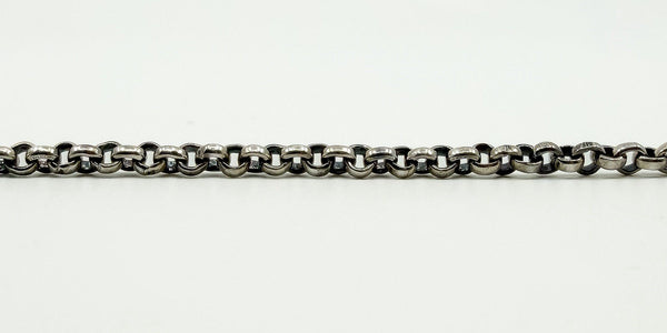 Close detail of the sterling silver rolo chain links with polished rounded 2.8mm link style