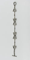 Vintage sterling silver horsebit snaffle bracelet laid straight to show the full 7.5 inch length.