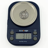 Vintage sterling silver St Christopher pendant charm shown on scales weighing approximately 3.11g.