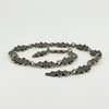 Low angled view of the Art Deco St Johns Ambulance watch chain showing the linked dated sterling silver award bars.