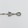Close up of the sterling silver T-bar closure and chain section on the horsebit snaffle bracelet.