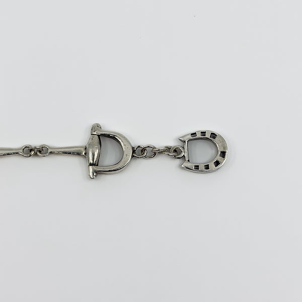 Close up of the sterling silver T-bar closure and chain section on the horsebit snaffle bracelet.