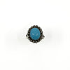 Front view of the turquoise cabochon and rough cut diamond halo ring