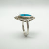 Side angle showing depth of turquoise cabochon set in sterling silver