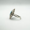 Profile view of vintage turquoise navette ring in sterling silver