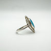 Side view of marcasite and turquoise silver ring showing raised setting