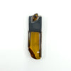 Sterling silver amber pendant front view on white background.