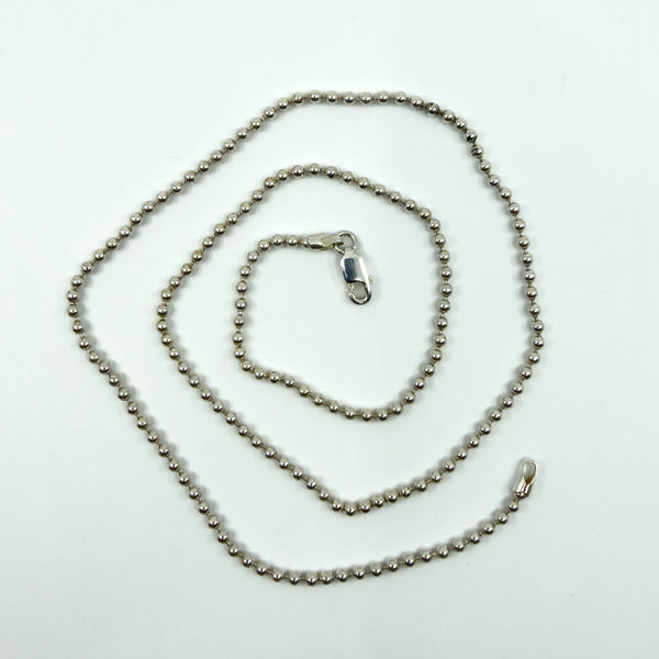 Sterling silver beaded ball chain necklace with lobster clasp, shown full length on white background.