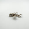 Side view of silver bee pendant showing loop and textured body