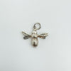 Side view of sterling silver bee charm showing attachment hoop