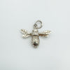 Front view of sterling silver bee charm with detailed wings and dotted body