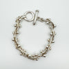 Secondhand sterling silver bracelet featuring chunky twisted links and smooth ball detailing