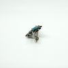 Close side view of the brooch showing the pin, hinge and C hook clasp fitting.